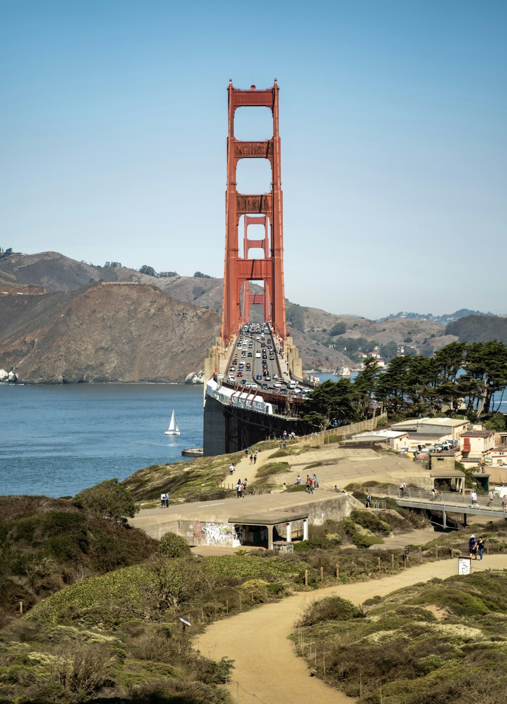 a view of the golden gate bridge from the top of a hill