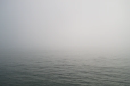 A radar blind spot shrouded in mist, evoking stealth and invisibility.