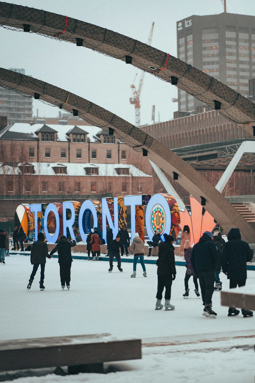 a group of people skating on an ice rink