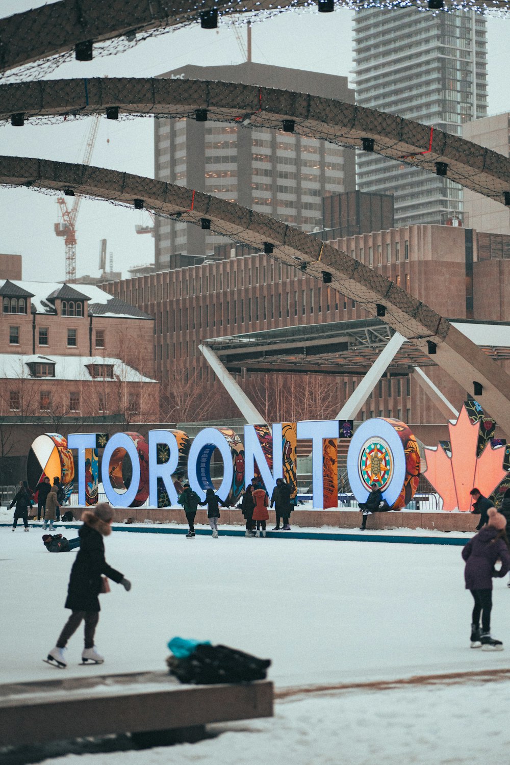 a group of people skating on an ice rink