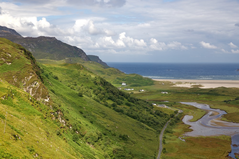 a scenic view of a winding road in the mountains