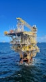an oil rig in the middle of the ocean