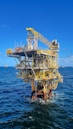 an oil rig in the middle of the ocean