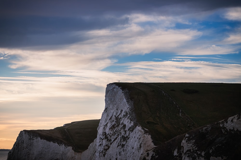 a person standing on the edge of a cliff