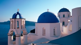 a white and blue church with a blue dome