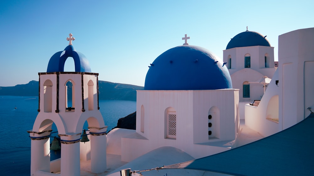 a white and blue church with a blue dome