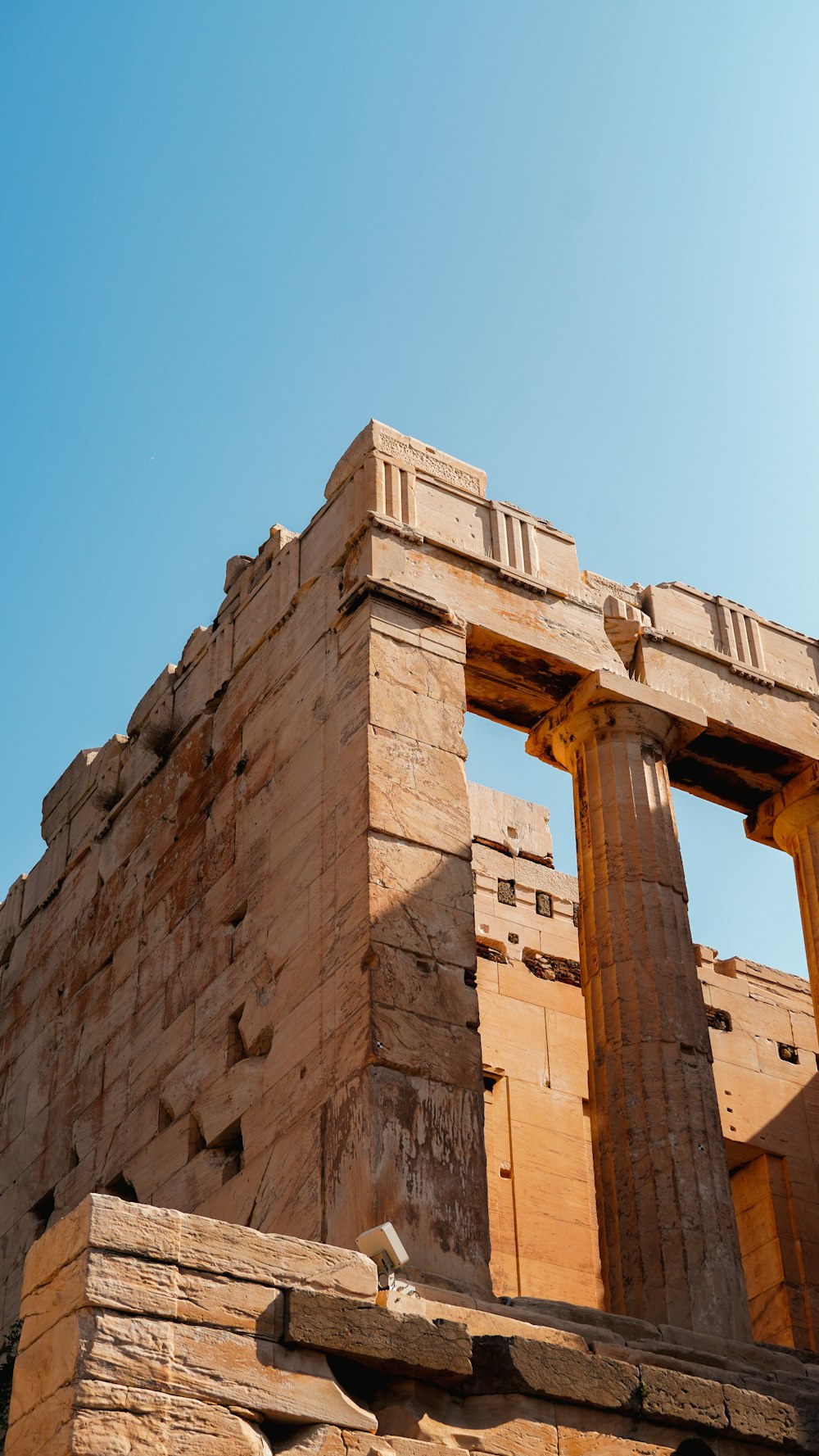 a tall brick structure with two large pillars