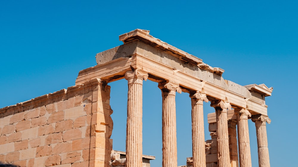 a large stone structure with two columns on top of it