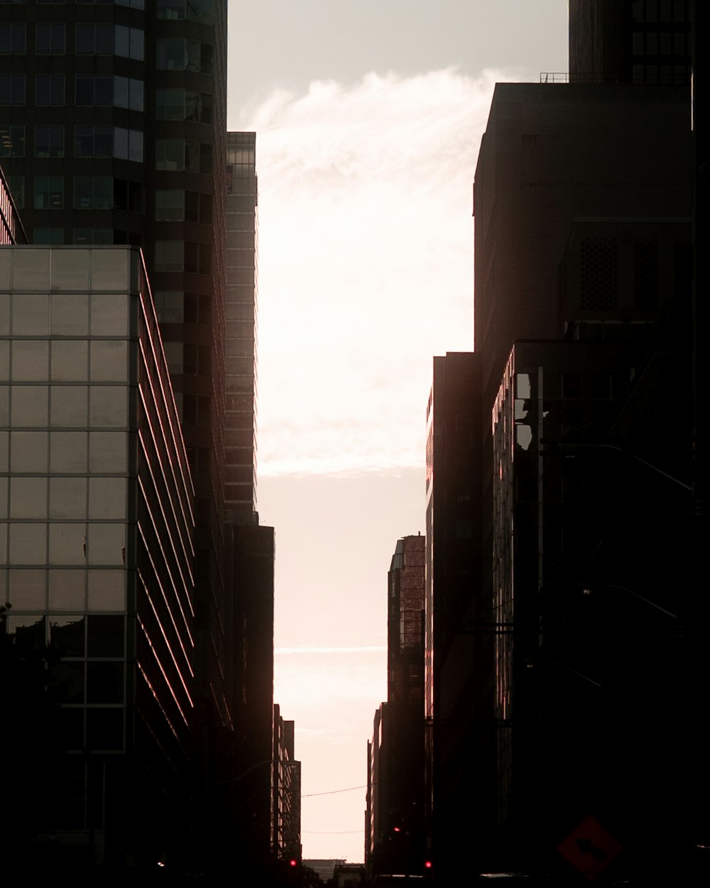 a view of a city street with tall buildings