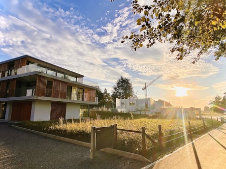 Modern residential building under construction in Ingeniero Maschwitz at sunset.