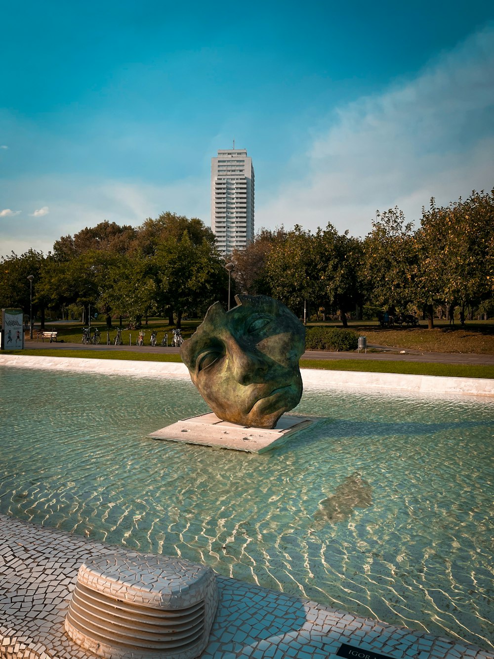 a sculpture of a shell in a public park