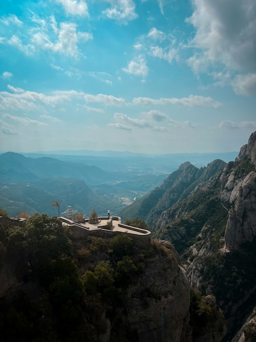 a scenic view of mountains and a road