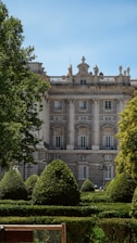 a large building with a lot of trees in front of it