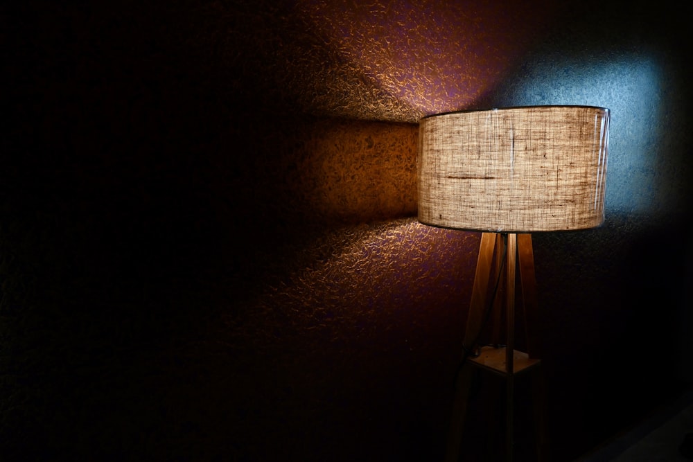 a lamp that is on in a dark room