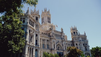 a large white building with a clock tower