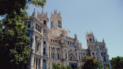 a large white building with a clock tower