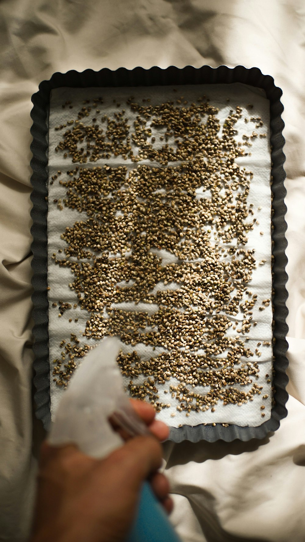 a person is decorating a cake with sprinkles