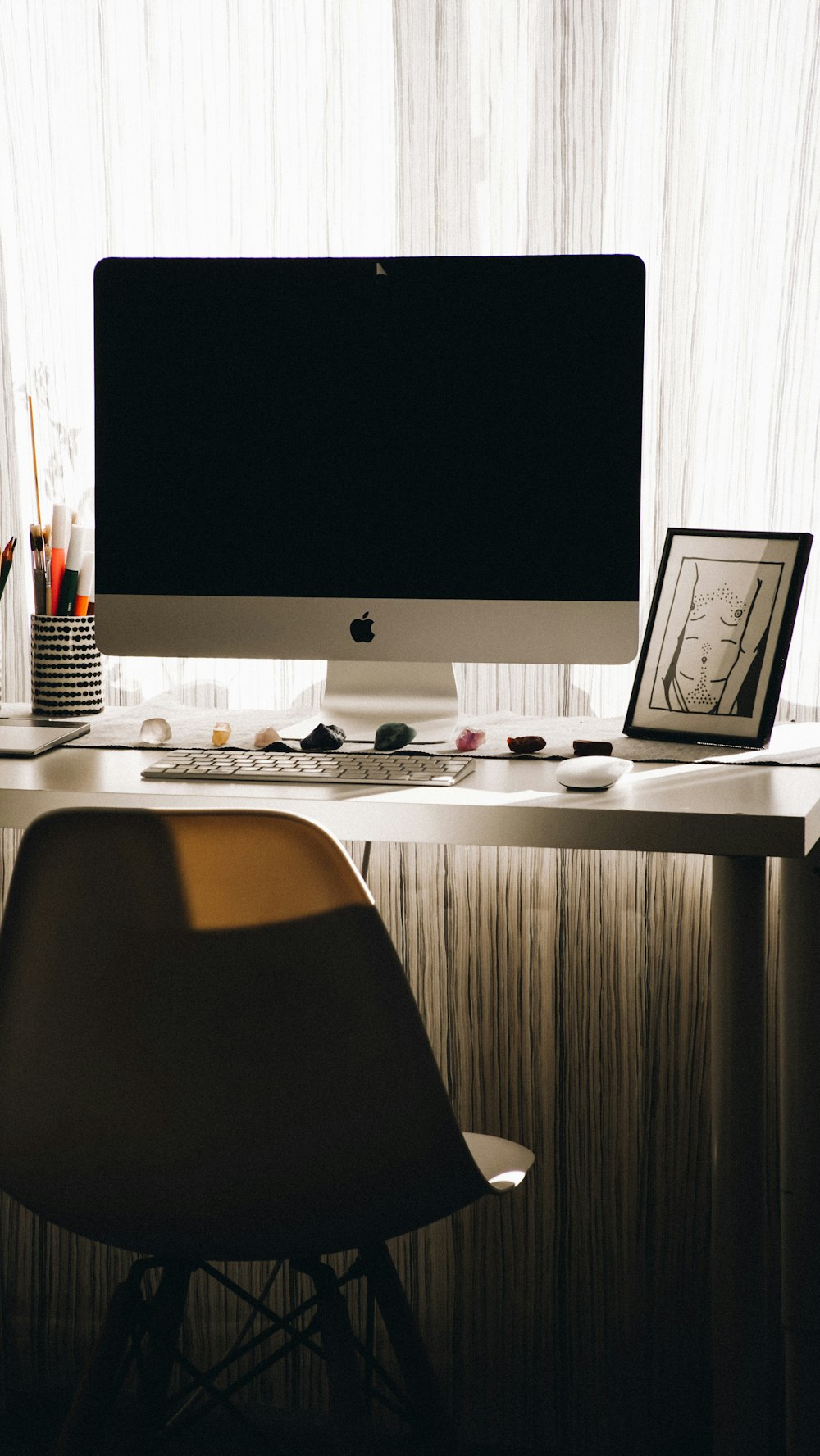 a computer monitor sitting on top of a desk