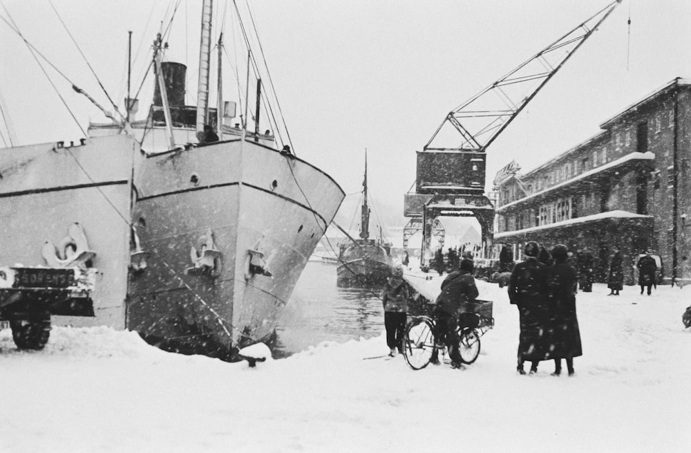 a large boat sitting on top of snow covered ground