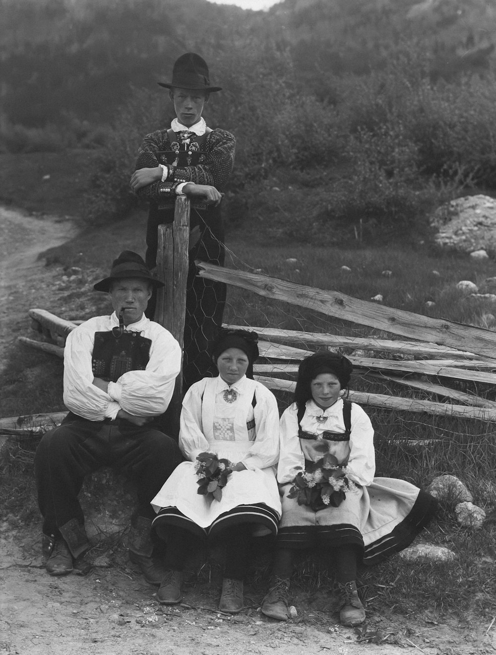 a group of people sitting on a wooden bench