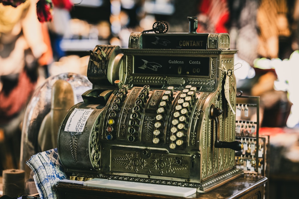 an old fashioned typewriter sitting on top of a table