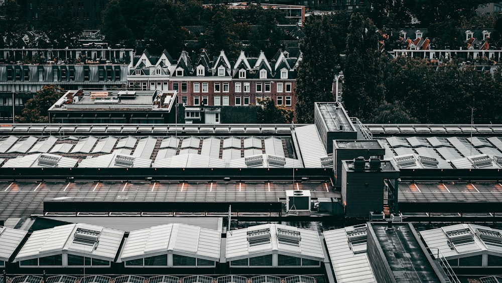 an aerial view of a train station in a city