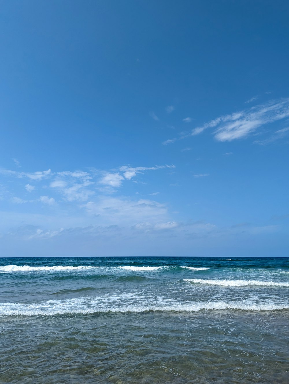 a person riding a surfboard on top of a wave