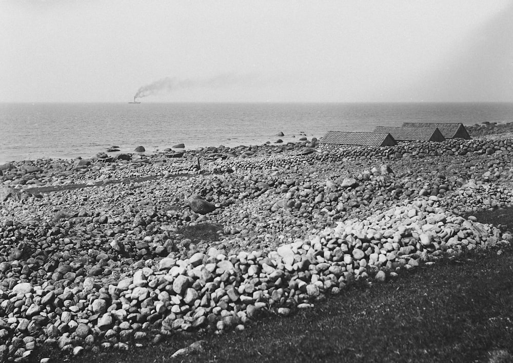 a black and white photo of a rocky beach