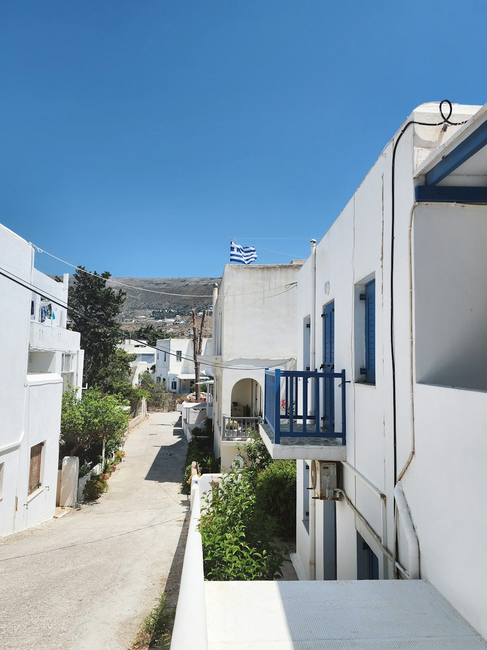 a view of a narrow street in a small town