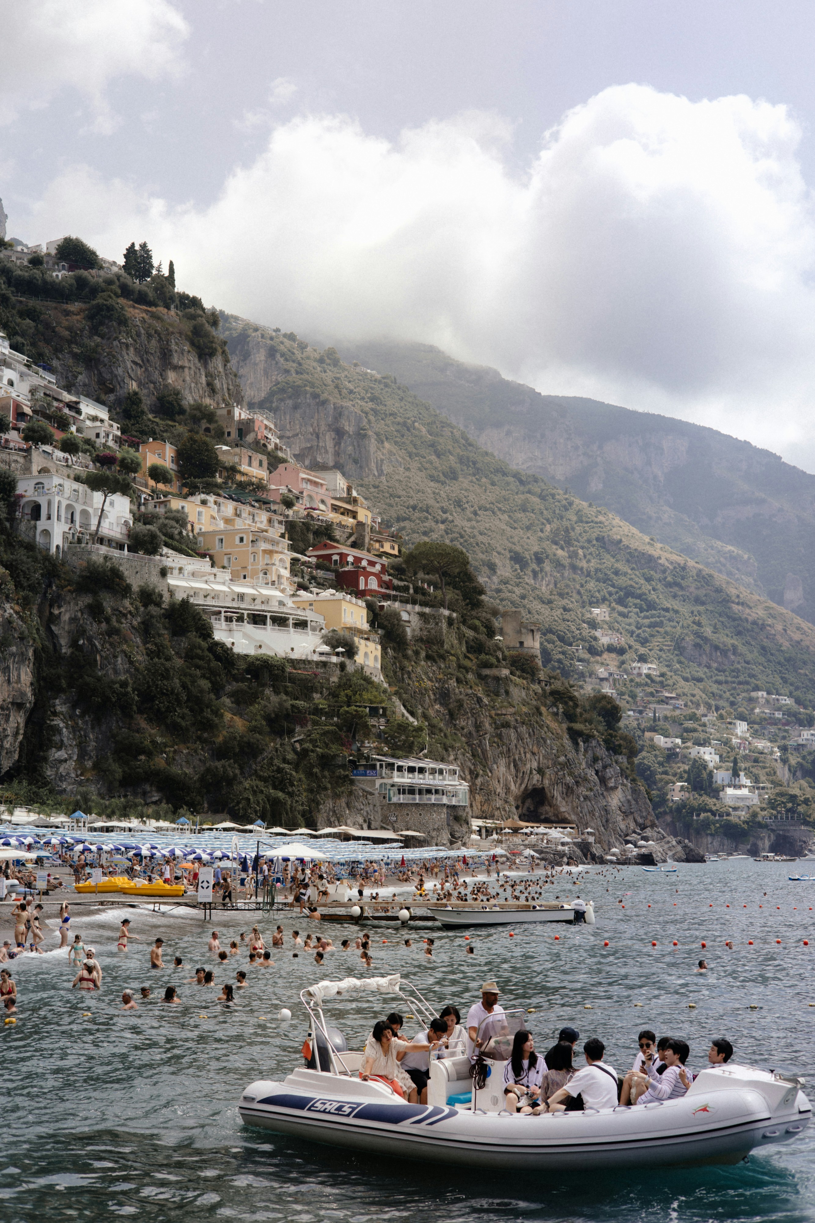 A group of people on a boat in the water photo – Free Boat Image on ...