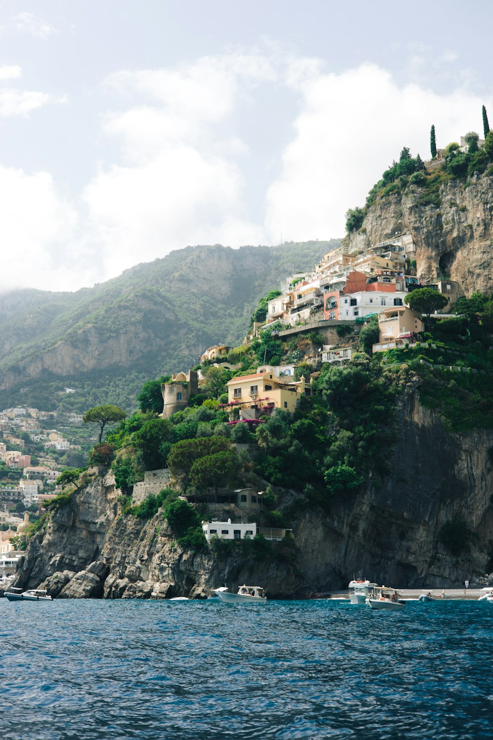 a small village on a cliff above the ocean