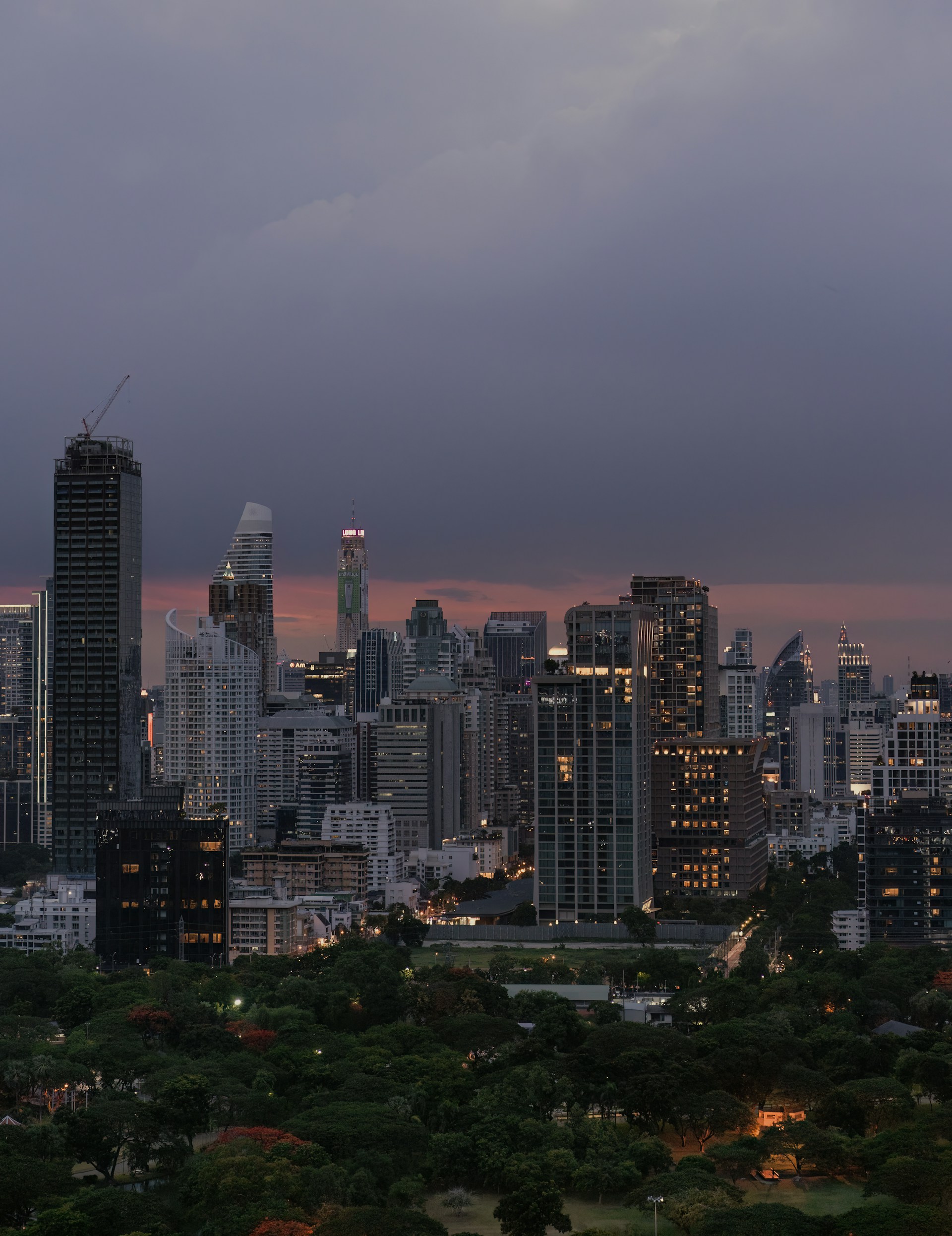 a view of a city skyline at dusk