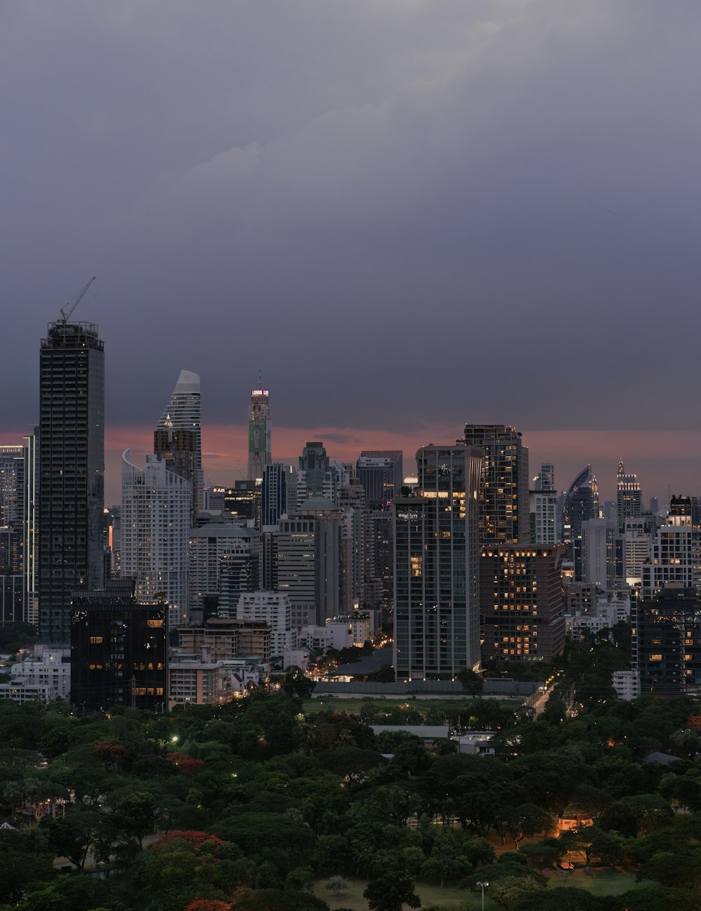 a view of a city skyline at dusk