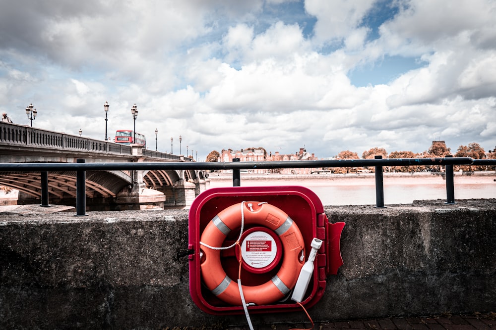 a life preserver on the side of a bridge