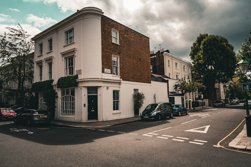 a white building sitting on the side of a road