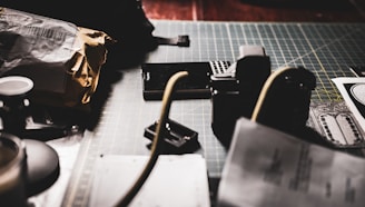 A modern workspace featuring packaging materials and tools.