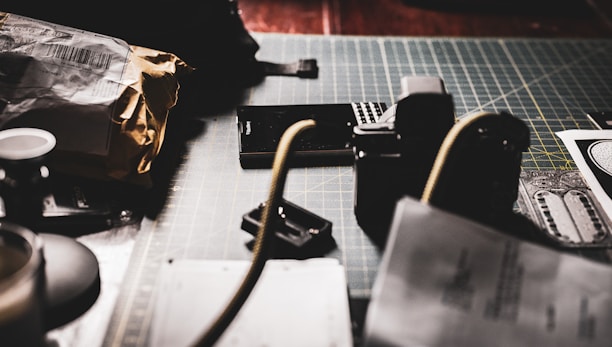 A cozy workspace showing a seller photographing a vintage coin against a dark, elegant backdrop.