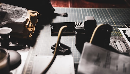 A warm-toned minimalist workspace showing packages and shipping documents symbolizing international import.