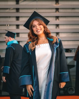 a woman in a graduation cap and gown