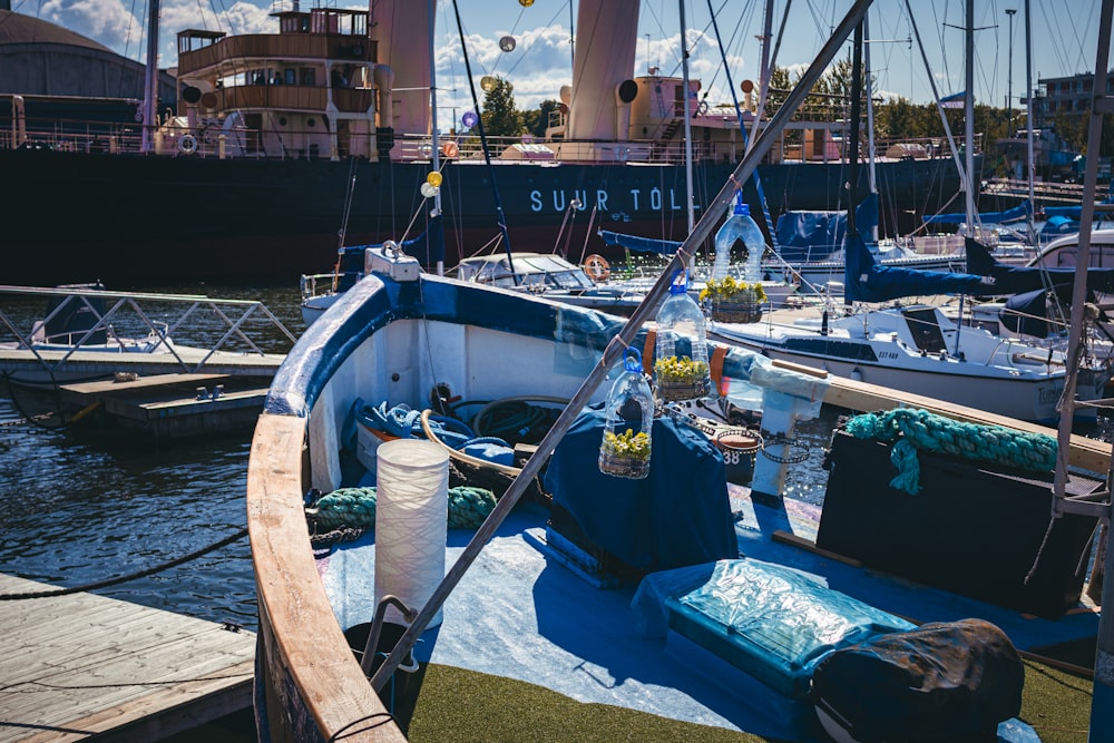 a boat docked in a harbor with other boats
