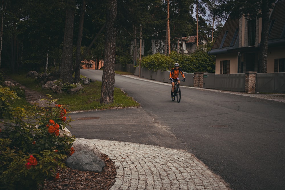 a person riding a bike down a street