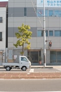 Modern moving truck parked outside a residential building in Abu Dhabi