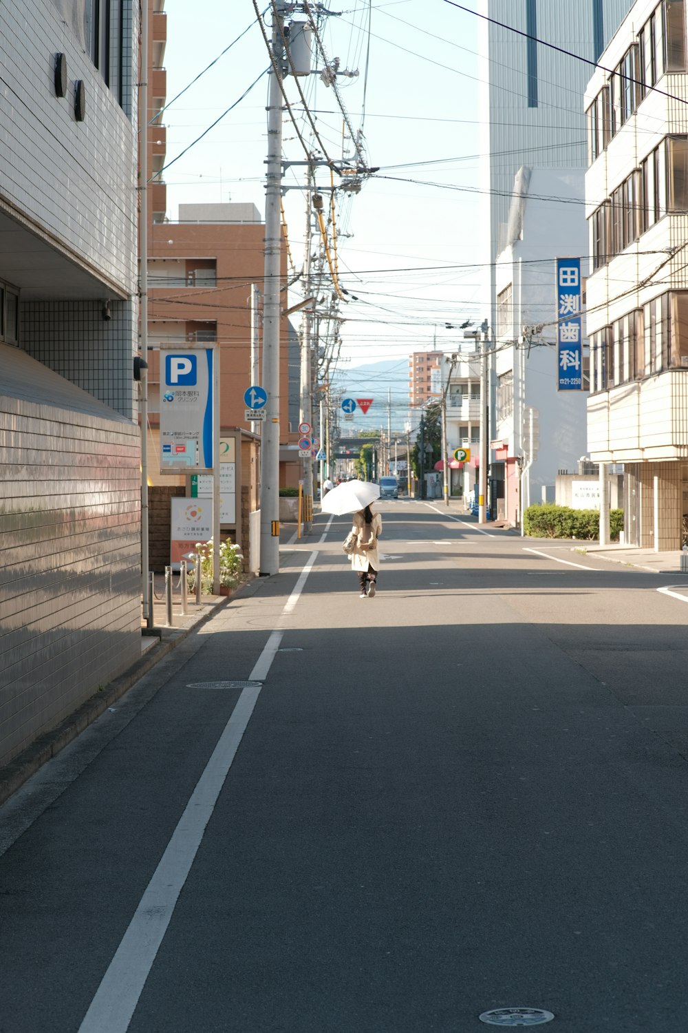 a person riding a skateboard down a street