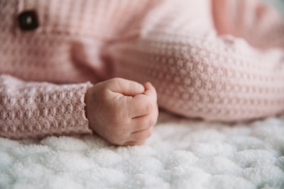 Close-up of soft baby accessories like hats and mittens