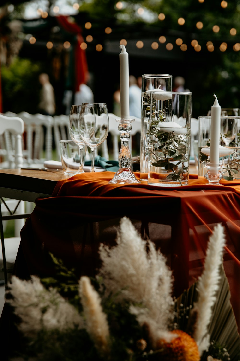 a table is set with candles and flowers