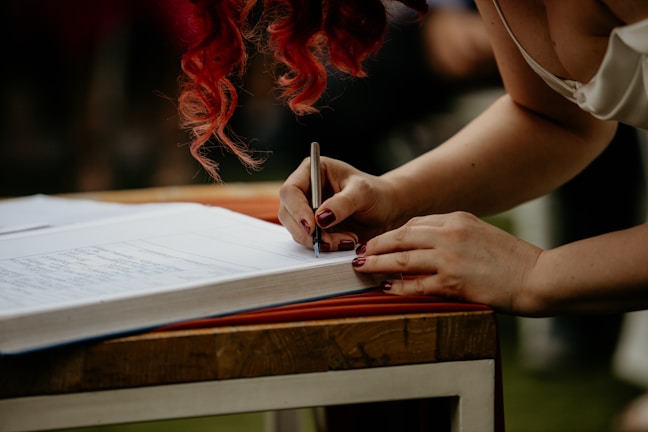 Beverly Karno signing a book at a local community event.