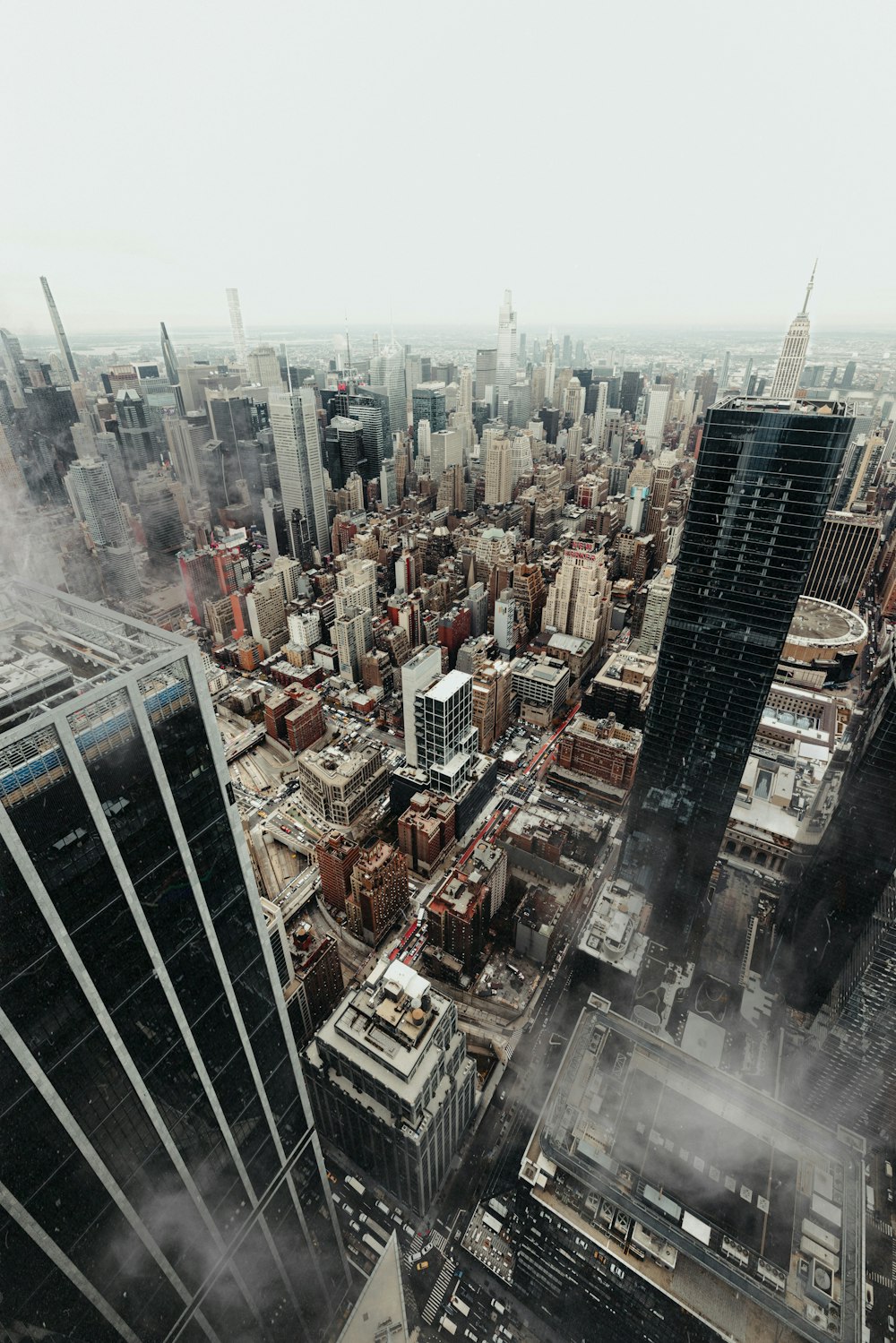 an aerial view of a city with tall buildings