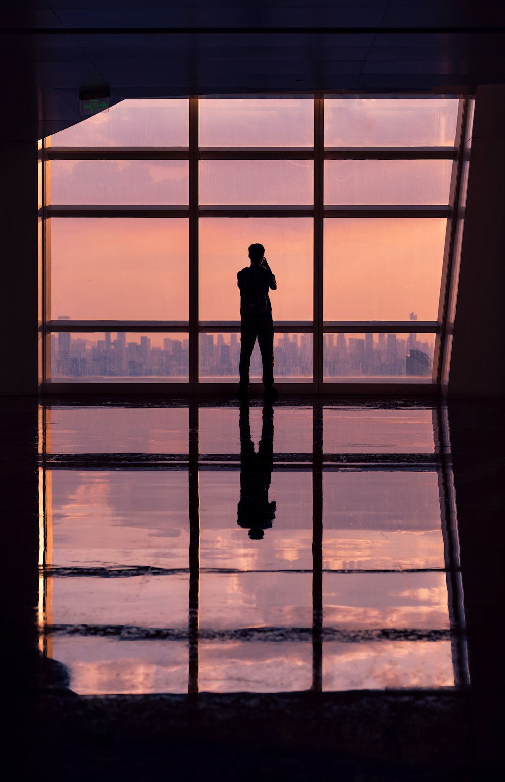 a person standing in front of a large window