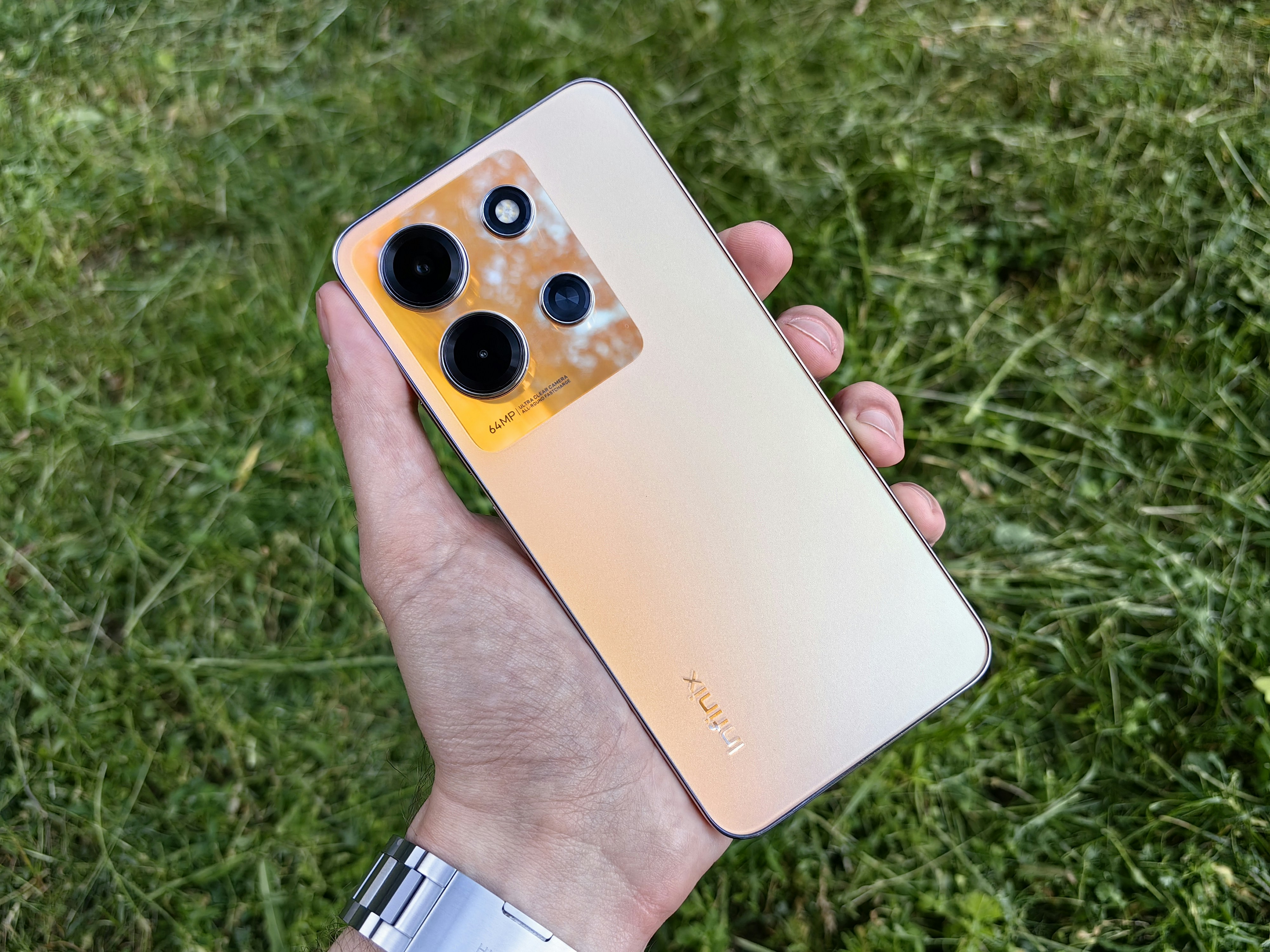 a person holding a cell phone in their hand