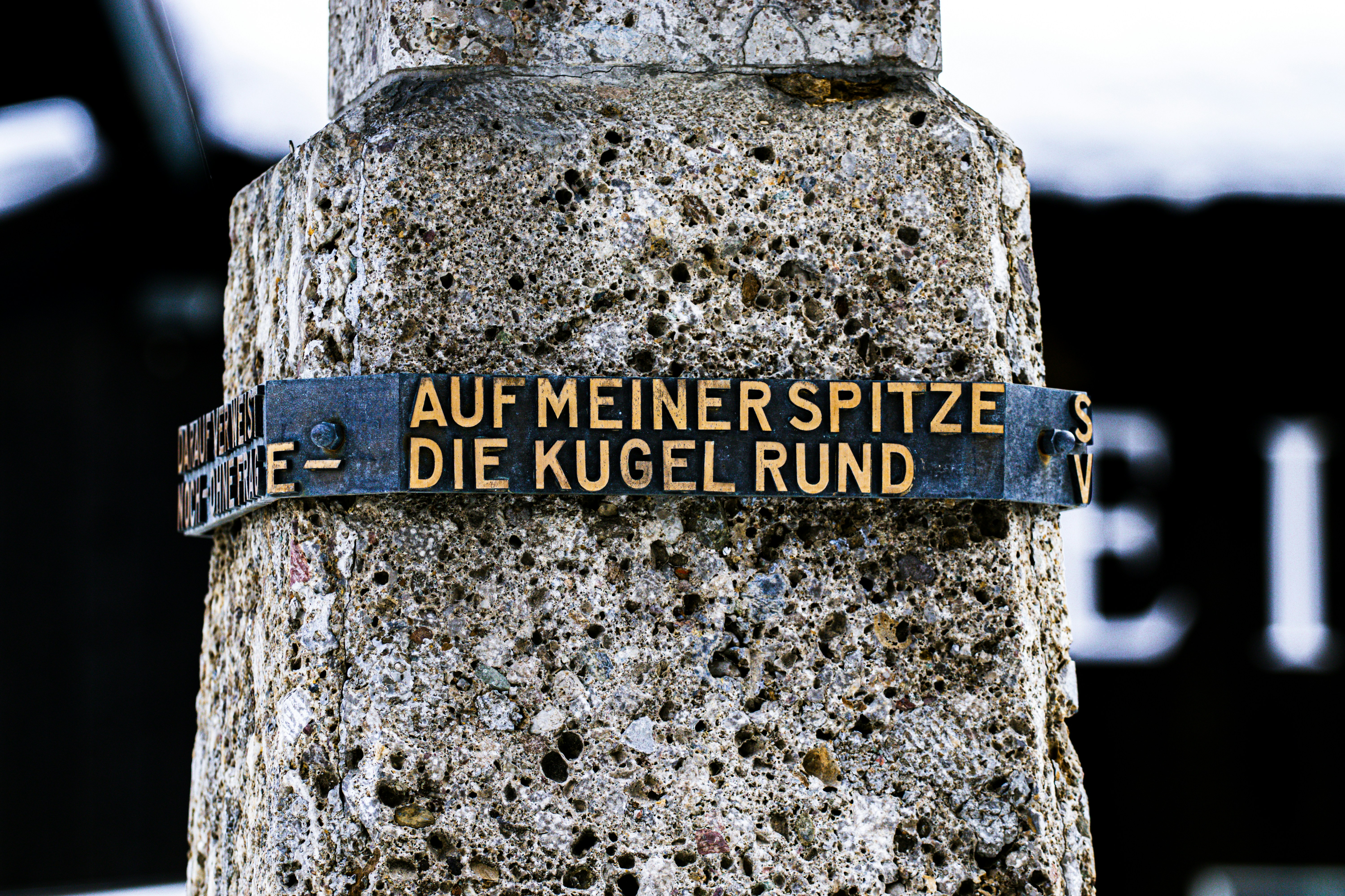a close up of a street sign on a pole